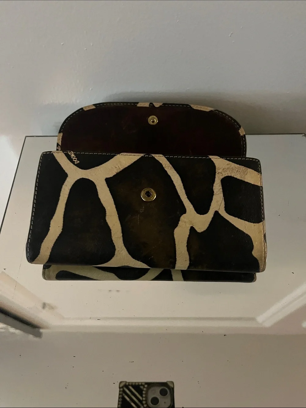 Dooney & Bourke Black and Cream Giraffe-Print Leather Clutch